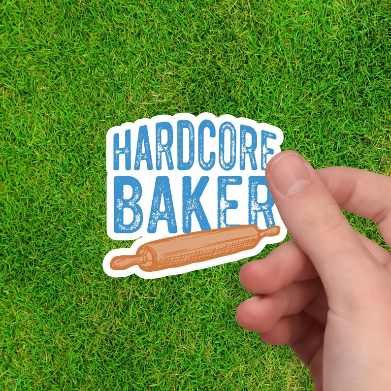 May include: A blue and white sticker with the text "HARDCORE BAKER" and a drawing of a rolling pin.