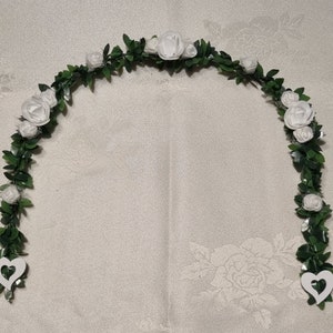 Place of honor tendril boxwood garland communion baptism confirmation birthday white foam roses table decoration