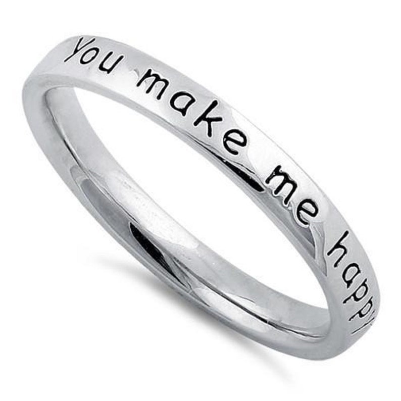 May include: A silver ring with the inscription "You make me happy" engraved on the band.