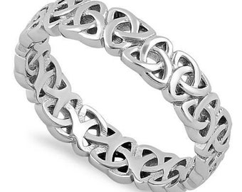 May include: A silver Celtic knot ring with a detailed intricate design.