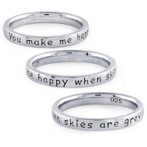 May include: Three silver rings with the inscription "You make me happy when skies are grey".