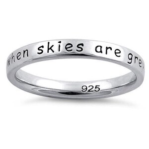 May include: Sterling silver ring with the inscription "when skies are grey".