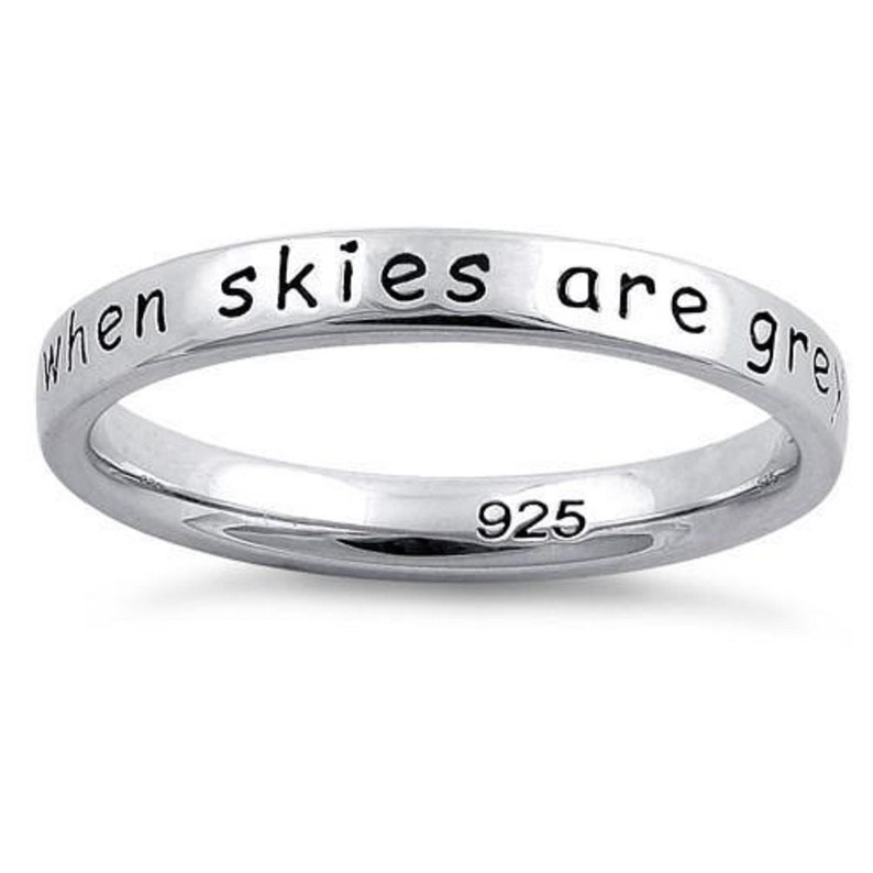 May include: Sterling silver ring with the inscription "when skies are grey".