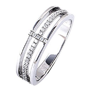 May include: A silver ring with three bands, each set with small clear stones. The center band has a cross design.