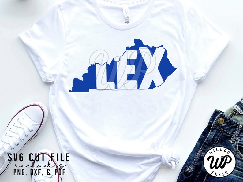 May include: A white t-shirt with a blue outline of the state of Kentucky and the word "LEX" in white letters inside the outline.