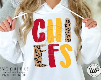 May include: White hoodie with the word "CHIEFS" in red, yellow, and black leopard print letters. The letters are outlined in black.