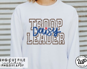 May include: A white sweatshirt with brown text that reads "TROOP Daisy LEADER" with a small red heart between "TROOP" and "Daisy".