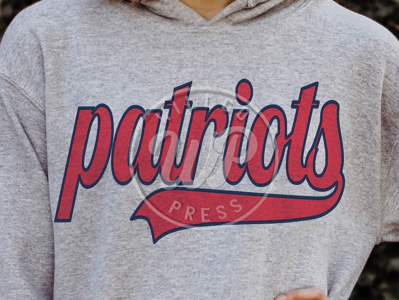 May include: Grey hooded sweatshirt with a red and blue "patriots" graphic with a red and blue "press" logo.