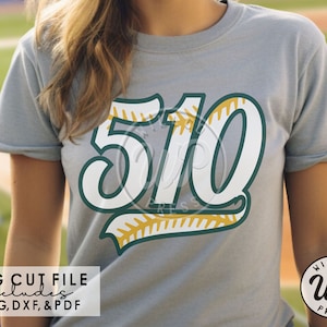 May include: A gray t-shirt with a white and green baseball-themed design featuring the number "510" with a yellow stitching detail. The text "SVG CUT FILE includes PNG, DXF, & PDF" is at the bottom of the image.
