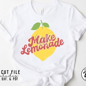 May include: White t-shirt with a yellow lemon and red text that says "Make Lemonade".