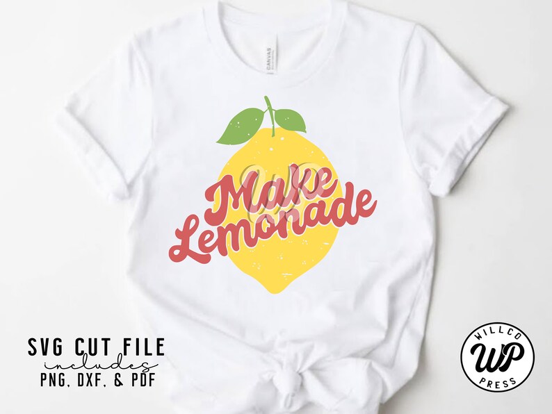 May include: White t-shirt with a yellow lemon and red text that says "Make Lemonade".