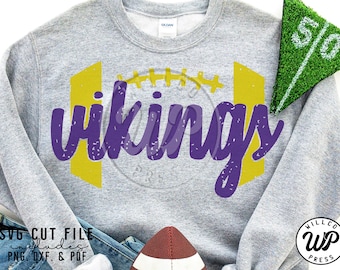 May include: A gray sweatshirt with a purple and yellow design of a football with the word "vikings" in a distressed font.