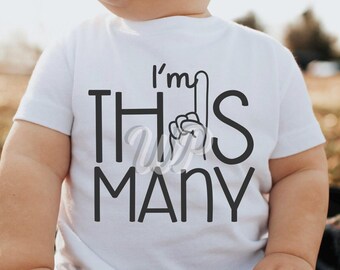 May include: White baby onesie with black text that reads "I'm this many" with a black hand pointing up with one finger.