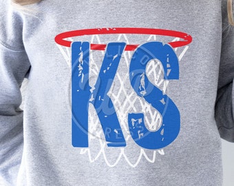May include: Gray sweatshirt with a blue and white basketball hoop design. The hoop has a red rim and the letters "KS" are inside the hoop.