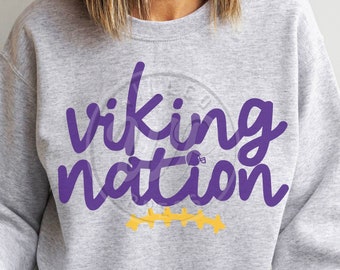 May include: A gray sweatshirt with the words "viking nation" in purple lettering. There is a small football helmet graphic and five yellow stars below the text.