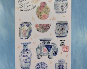 May include: A sticker sheet featuring various illustrations of porcelain ceramics, including blue and white garden stools, vases, and an elephant-shaped vessel. The sheet includes text reading Porcelain of Shirley Chang, www.divibaba.studio, and a red square stamp with characters.