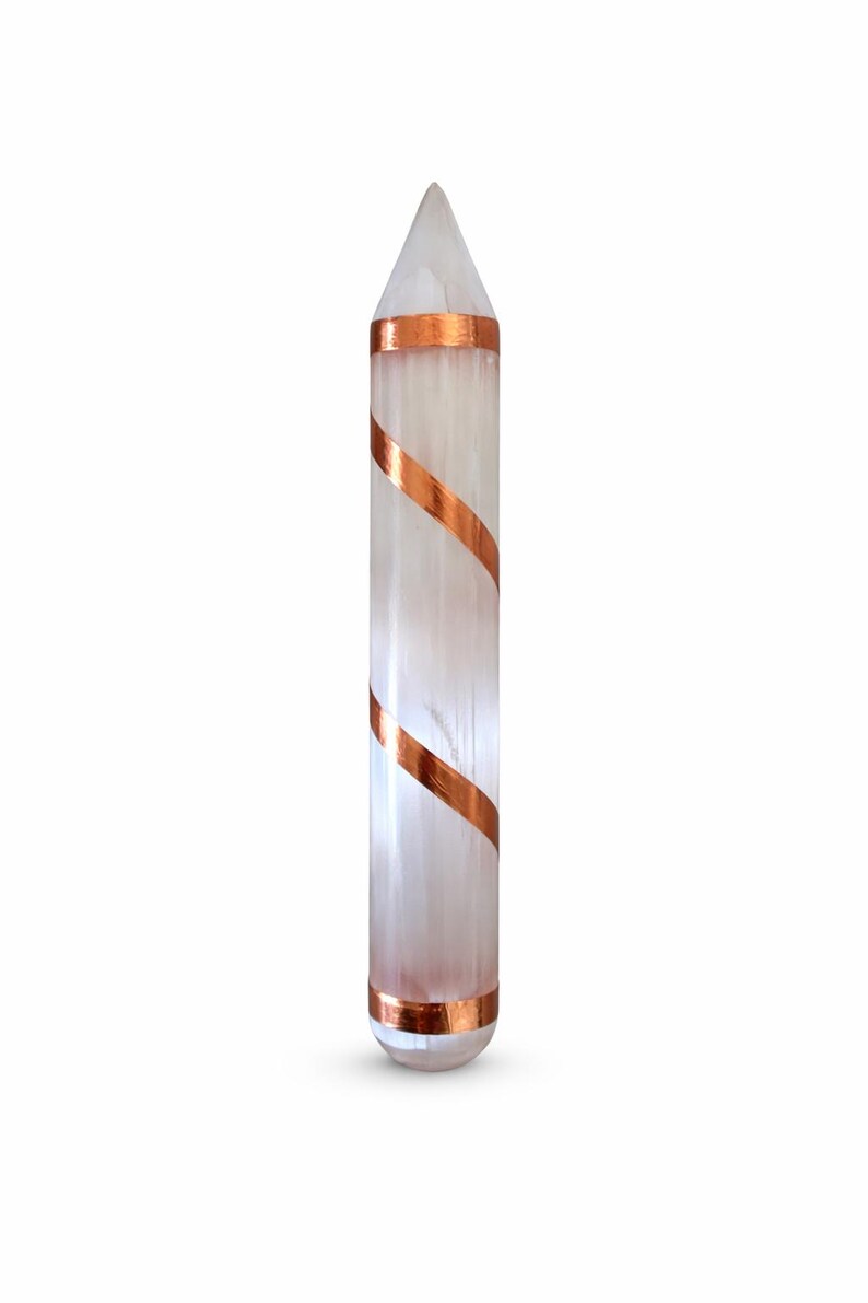 May include: A clear, elongated crystal with a pointed top, wrapped with copper-colored bands. The crystal is a light, translucent color, and the copper bands are spiraled around the body of the crystal.