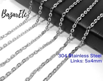 May include: Multiple silver chains made of 304 stainless steel with links measuring 5x4mm.  The chains are laid out on a black surface.