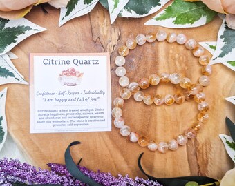 May include: Citrine Quartz bracelet with a card that reads "Confidence - Self-Respect - Individuality "I am happy and full of joy." Citrine quartz is heat treated amethyst. Citrine attracts happiness, prosperity, success, wealth and abundance and encourages the wearer to share this with others. The stone is creative and promotes self-expression."