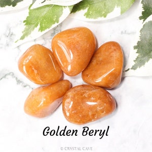 May include: Five smooth, golden beryl tumbled stones. The stones are a warm, honey-like colour and have a glossy finish. Golden beryl is a variety of beryl that is known for its golden colour.