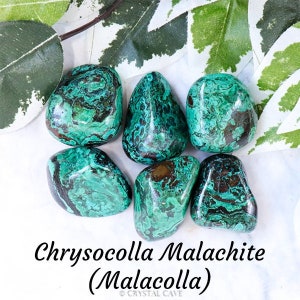 May include: A collection of six tumbled chrysocolla malachite stones, also known as malacolla. The stones are a mix of green and brown with swirling patterns.