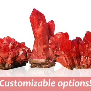 May include: Three red crystal clusters, each with a unique shape and size. The crystals are made of a shiny, translucent material and have a natural, rough texture. They are arranged on a white background.