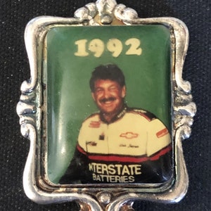 1992 Interstate Batteries (top) on Silver Plated Souvenir Spoon - pre-owned 7.95 Size: 4 1/2&quot; x 1&quot;