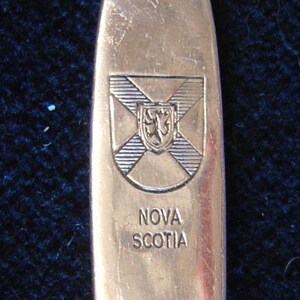 Crest of Nova Scotia, Canada (top) Engraved on Silver Plated Souvenir Spoon - pre-owned