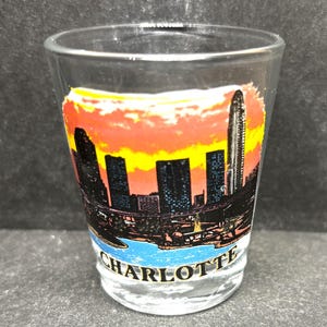 Charlotte, North Carolina and Skyline on 1oz Glass Shot Glass - NEW