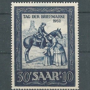 May include: A blue and white stamp with the text "TAG DER BRIEFMARKE 1952" and "30'SAAR+10". The stamp features a black and white illustration of a person on horseback.