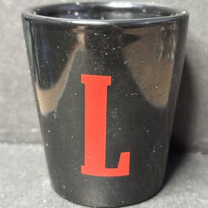 Fireball Cinnamon Whiskey * Tastes Like Heaven ~ Burns Like Hell * with "L" on 1oz Black Ceramic Shot Glass - NEW image 2