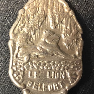 Le Lion, Belfort, France (top) on Souvenir Spoon - pre-owned