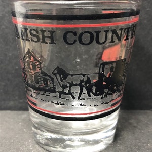 Amish Country, Pennsylvania with Covered Bridge, Horse & Carriage, Barn, etc 1oz Glass Shot Glass - NEW