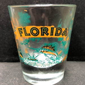 Florida with Sword Fish, Palm Tree and Water Scenes on 1oz Glass Shot Glass - NEW