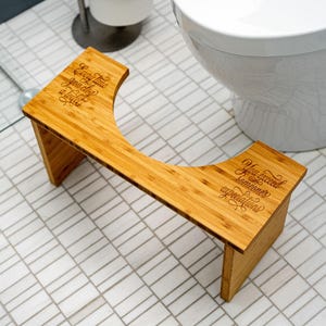 May include: A set of three ceramic mugs with a speckled, matte finish. The mugs are in shades of cream, light gray, and dark gray. Each mug has a simple, minimalist design and a rounded handle.