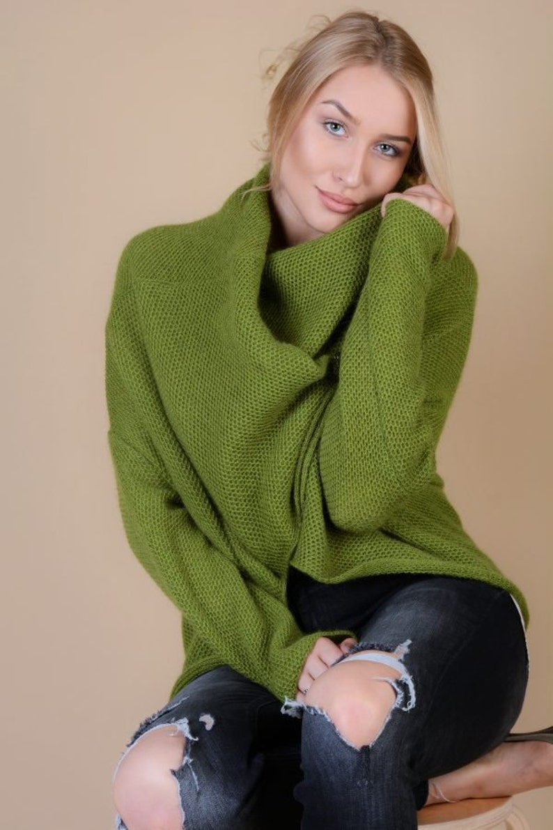 green sweater blue pants