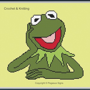 May include: A pixelated image of Kermit the Frog, in shades of green, red, and white, with the text "Crochet & Knitting" at the top. The frog is smiling with one hand on his chin. Copyright Pegasus Signs is at the bottom.