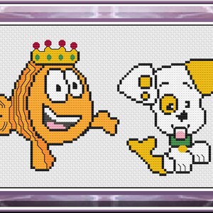 May include: Cross-stitch design featuring an orange fish wearing a gold crown and a white puppy with yellow accents. The fish is smiling, and the puppy has its tongue out. The design is framed in a purple border.