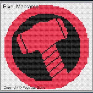 May include: A cross-stitch design featuring a red hammer within a black shape, set against a red circle. The design is framed with a white background and a black border. Text at the top reads "Pixel Macrame" and at the bottom "Copyright © Pegasus Signs."