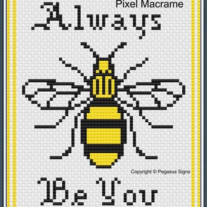 May include: Black and white pixel art design of a bee with the text "Always Be You" and the words "Pixel Macrame" and "Copyright © Pegasus Signs".