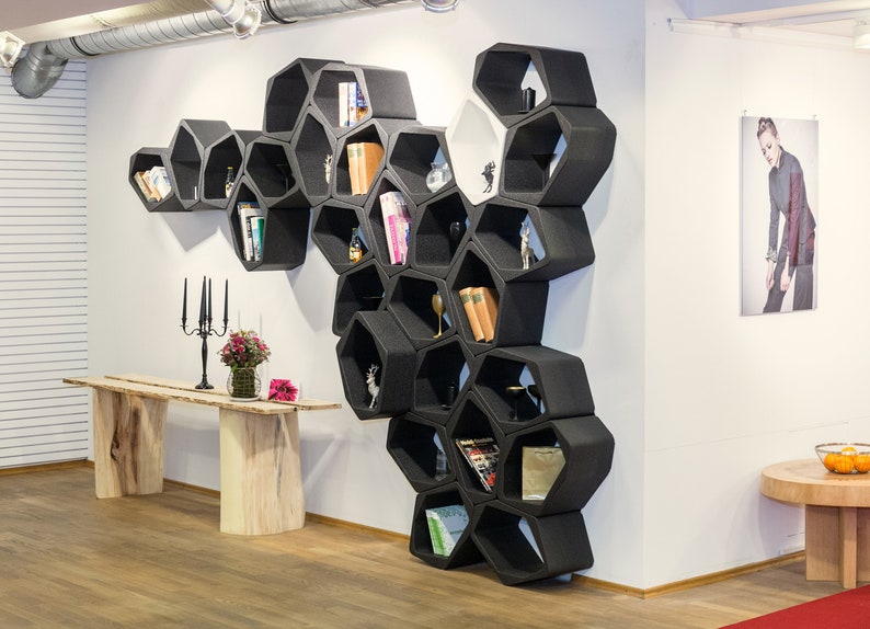 Enhance your decor with this set of sustainable modular black hexagon-shaped wall shelves and bookcases, offering versatility as wall shelves, hanging shelves, or freestanding units. Elevate your space with this eco-friendly choice.
