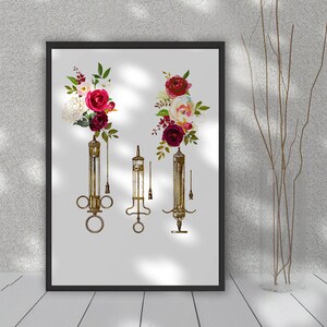 May include: Vintage medical syringes with floral accents. The syringes are made of glass and metal and have a rustic, antique look. The flowers are red, white, and green and are arranged in a bouquet around the syringes.