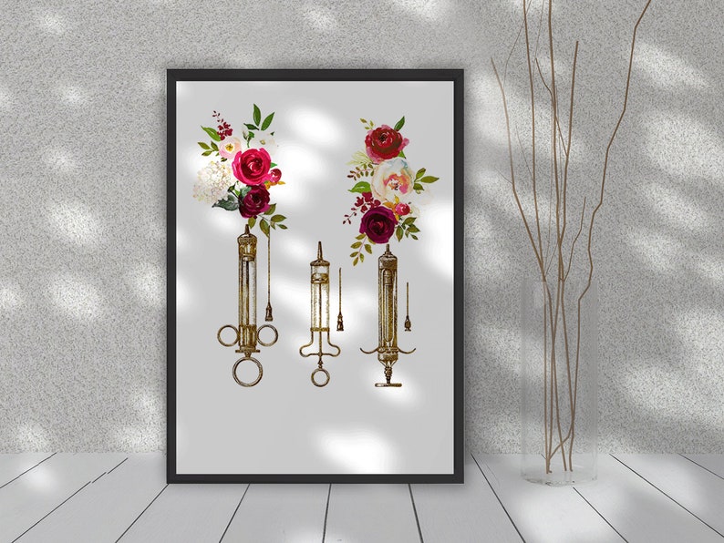 May include: Vintage medical syringes with floral accents. The syringes are made of glass and metal and have a rustic, antique look. The flowers are red, white, and green and are arranged in a bouquet around the syringes.