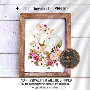 May include: A digital illustration of a baby in a womb surrounded by pink, white, and peach flowers. The image is in a gold and white color scheme. The text "Instant Download JPEG Files" is at the bottom of the image.