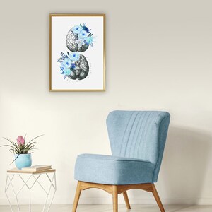 May include: A framed print of a human brain with blue flowers. The brain is a vintage anatomical illustration. The flowers are watercolour painted.