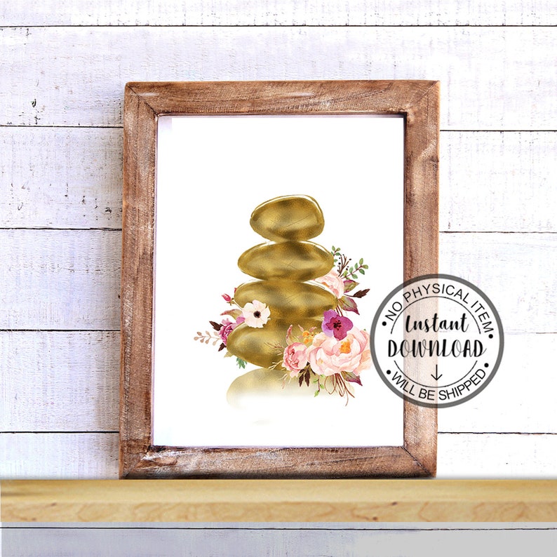 May include: A digital print of a gold zen stack of stones with pink and purple flowers. The print is framed in a brown wood frame.