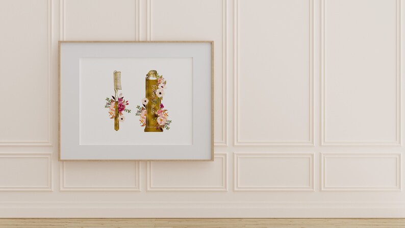 May include: A framed print with a gold toothbrush and a gold tube of toothpaste, both decorated with pink and white flowers.