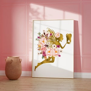 May include: A gold silhouette of a fairy with wings holding a tooth, surrounded by pink and purple watercolor flowers on a white background.
