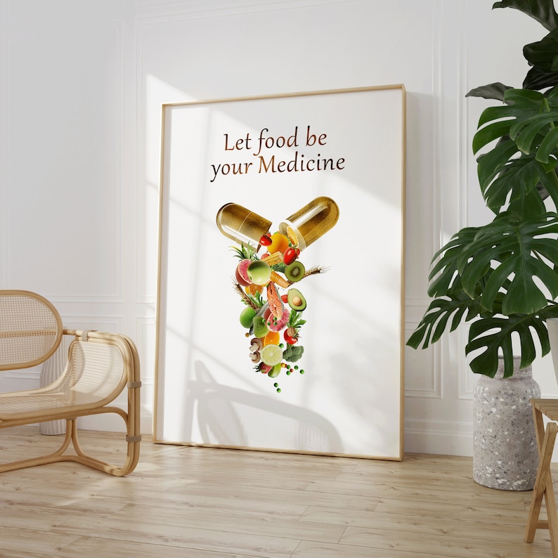 May include: A white poster with the text "Let food be your medicine" and a graphic of a golden capsule with various fruits, vegetables, and other food items spilling out.
