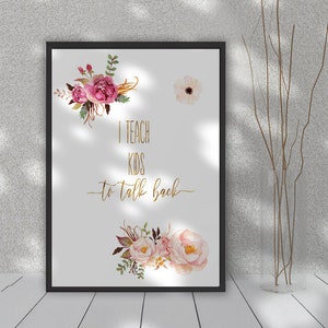 May include: A framed print with a white background and pink and gold floral illustrations. The text "I teach kids to talk back" is written in gold lettering.